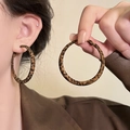 Chic leopard print geometric hoop earrings for women shown worn on a model in soft lighting - 35# Silver Earring Post - Leopard Print - Round - Extra Large