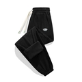 Pantaloni sportivi da uomo in pile nero con coulisse in vita e polsini elastici - S / Nero