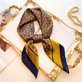 Detailed close-up of yellow and navy geometric silk scarf on an elegant golden tray - 70*70cm / FJ566-4 (Ginger & Navy Geometric)