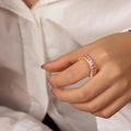 Elegant gold ring featuring rectangular pink zircon stones worn on the index finger - Style A Pink
