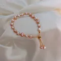 Baroque lavender freshwater pearl bracelet with golden adjustable slide clasp on white silk - Pink Freshwater Pearl (3#)