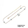 Detail of gold floral necklace with blue zircon flowers, 40+5cm length and 0.8cm charms - Gold - Blue Flower