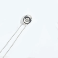 Polished silver bubble bean pendant necklace with delicate link chain on white background - Letter O
