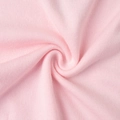 Close-up of soft pink knit fabric texture showing vertical ribbed details and elasticity - S / Pink