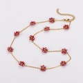 Minimalist gold chain necklace featuring multiple small purple flower beads for women - Light Red