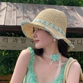 Women's straw sun hat with light blue 3D flower detail and woven green leaf ribbon - Foldable Straw Hat Beige Blue Flower