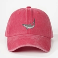 Close-up of embroidered shark patch on red washed cotton vintage baseball cap - Watermelon red