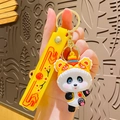 3D panda keychain wearing a yellow lion dance hat with a lucky Fu charm and wrist strap - Yellow Lion Dance Hat