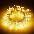 Detalle de luces LED de alambre de cobre flexible con cálido brillo amarillo festivo - 1.5m 50LED Mando USB 8 Funciones - Hilo Plateado Luz Cálida