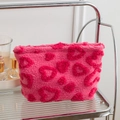 Pink plush cosmetic bag with 3D fuzzy hearts and soft sherpa texture on display - Rose Red Heart