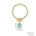 Gold Cuban chain bracelet with oval turquoise pendant and toggle clasp closure - Oval Stone Bracelet