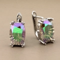 Macro shot of rectangular rainbow crystals set in silver metal luxury earrings - Silver Style 2
