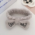 Gray plush spa headband with OMG embroidery and fluffy bow for skincare - Gray