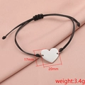 Minimalist woven rope bracelet with polished stainless steel heart pendant and sizing details - Silver (MP060)