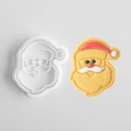 White plastic Santa Claus cookie mold with a decorated cartoon Christmas cookie - Santa Claus A