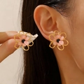 Vintage hollow gold flower earrings with pink petals and black center worn by a model - Sweet Fresh Hollow Frame Flower Studs / Pink Black Flower Gold Studs (18k Gold 0901)