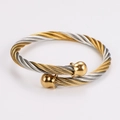 Macro detail of twisted cable wire bracelet with two-tone finish and gold end balls - Two-tone Gold and Silver