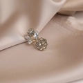 Elegant gold flower brooch with sparkling crystals on champagne silk background - 573# Flower