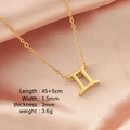Gold-finish Gemini constellation necklace with Roman numeral II on pink silk background - Gemini