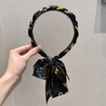 Black headband with Baroque print silk ribbon bow and woven gold chain detail - Vintage Black