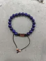 Adjustable blue lapis lazuli beaded bracelet with rose gold bar and woven cord - Lapis Lazuli