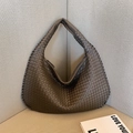 Brown woven leather hobo shoulder bag with minimalist triangular design and soft texture - Gray