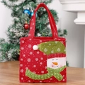 Christmas snowman gift bag with 3D embroidery and polka dot hat on wooden surface - Red Snowman Style