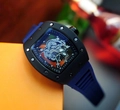 Skeleton wristwatch with blue rubber strap and black tonneau case showing inner gears - Black Case Blue Strap