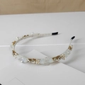 Macro shot of handmade crystal headband with faceted rhinestones and pearls detailing - Style SJ008 / Champagne Transparent