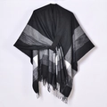 Detail view of monochrome plaid shawl poncho featuring fringe trim and soft wool texture - Plaid Tassel Black Tie-up (Silver Thread)