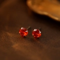 S925 sterling silver stud earrings with orange round-cut gemstone in classic claw setting - July Ruby
