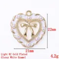 White heart charm with gold bow and bead accents for DIY handbags, 21mm x 22mm size - 13820-KC Gold Plated-Glossy White Enamel Heart Bow