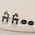 Macro view of matte black deer stud earrings with butterfly backs on a white display - Elk / Black
