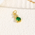Macro detail of a 18k gold turtle pendant with green teardrop zircon and white crystals - Green (Humanoid Style)