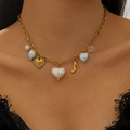 Dettaglio della collana in acciaio inossidabile 18K con ciondoli colorati e perle a cuore - Cuore alla Moda Multi-Elemento (13) / Oro