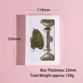 Green jade face roller and gua sha tool set in white gift box on pink background - Horn Scraper + Spiked Roller + Gift Box