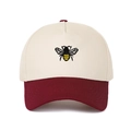 Close-up of detailed bee embroidery on ivory and burgundy two-tone cotton baseball cap - Burgundy