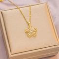 Elegant gold flower pendant necklace with clear zircon inlay on a luxury jewelry box - 6052 Flower Zircon / Gold
