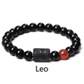 Detailed macro view of obsidian Leo zodiac bracelet with engraved black matte bead - Leo