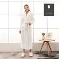 Long white flannel bathrobe for women with shawl collar and belted waist in a home setting - M / For Women / White