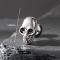Silver skull earring stud for men on dark rock background, size 1.45cm x 0.89cm - Skull Style (S199)