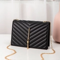 Elegant black quilted chain bag with gold tassel hardware and classic V-pattern stitching - Chevron Quilt / Black