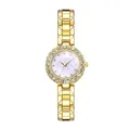 Detailed close-up of a gold-tone watch with sparkling rhinestone bezel and MOP dial - Individual Gold Watch