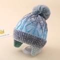 Detail of cable knit pattern and grey pompom on blue tie-dye earflap winter hat - One Size (3-8Y) / Black (Grey Pom Pom)