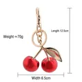 Red cherry keychain with gold stem and clip, dimensions 12.5cm by 6.5cm, weight 70g - Agate Rose Red Cherry with Light Gold Leaf