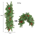 Macro detail of 90cm Christmas pine cone garland with red berries and flexible pine needles - 90cm