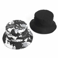Flat lay of reversible tie-dye and solid black cotton bucket hats for sun protection - One Size / Black Cyan Grey White (Reversible)