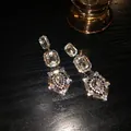 Detailed macro view of long baroque rhinestone earrings with sparkling geometric crystals - 18# Silver Earring Post - Eco - Silver