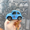 Detailed miniature blue car keychain toy with cartoon character print and ring - Cartoon Beetle Car Keychain / Blue