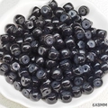 Macro shot of 6x8mm black polished barrel beads for DIY jewelry and beaded crafts - Black